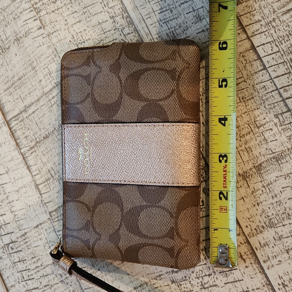 NWOT beautiful Coach wristlet khaki and metallic rose gold sort of color zip up